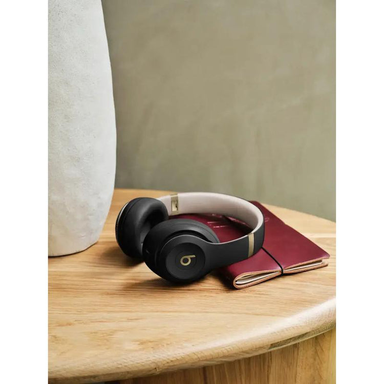 Side profile of Beats Studio Pro gold accents on ear cups