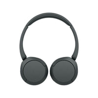 User wearing Sony WH-CH520 headphones during commute