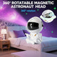 Astronaut Star Projector with 360° rotatable magnetic astronaut head illuminating bedroom ceiling.