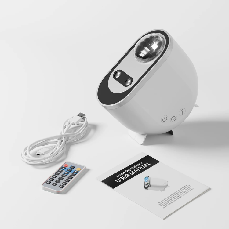 Aurora Northern Lights Projector with remote, manual, and power cord on a white background.