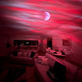 Aurora Northern Lights Projector projecting a red and blue light effect on a living room ceiling.