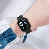 Astronaut Kids Square Digital Watch on a wrist, featuring a colorful LED screen and black strap.