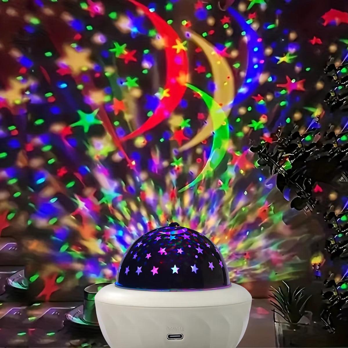 Galaxy Projector Night Light projecting colorful stars and patterns on a wall, creating a mesmerizing atmosphere.