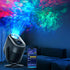 Aurora Wave LED Nebula Projector casting colorful northern lights on the ceiling with a smartphone remote.